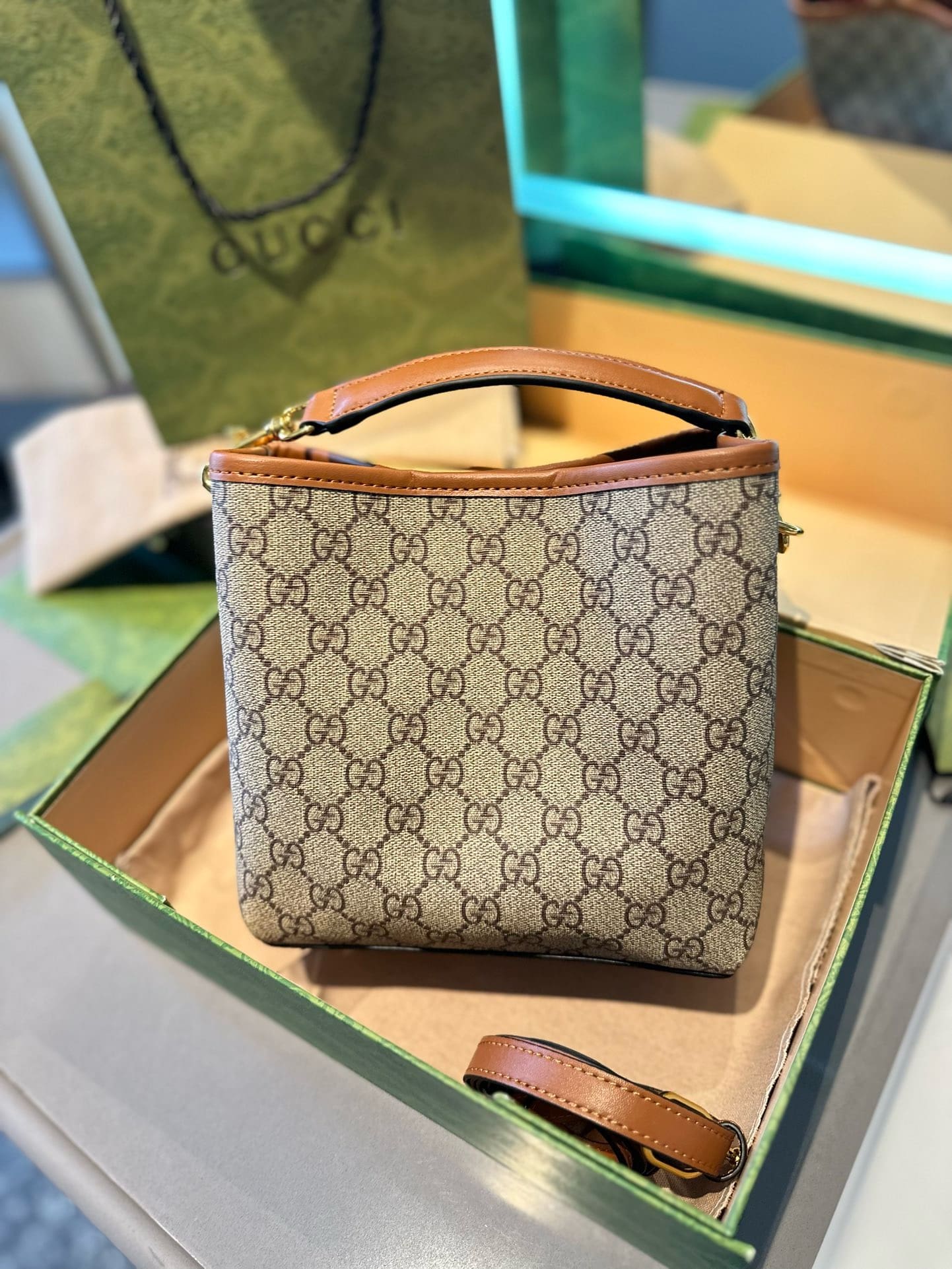 GUCCI GG Emblem mini bucket bag